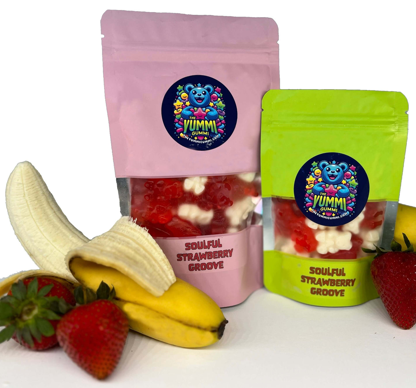 Soulful Strawberry Groove gummy bears in pink and green packaging with fresh strawberries and bananas.